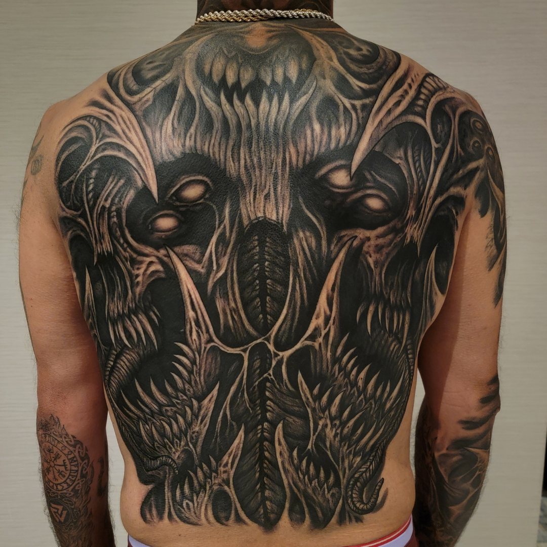 Black and grey tattoo sleeve by Symbolic Body Art