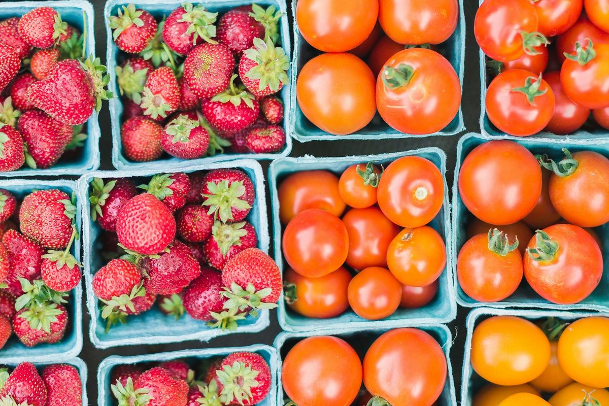 Baskets of strawberries and tomatoes