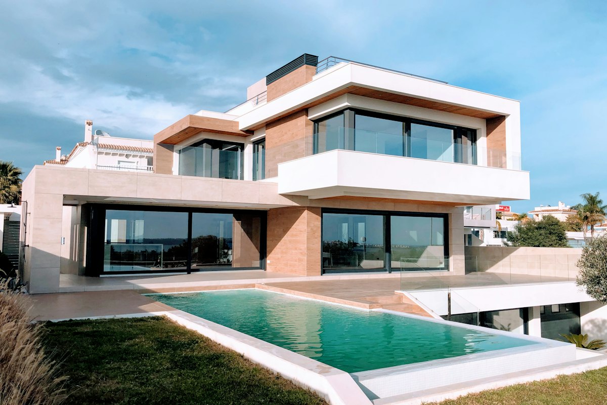 A modern two-story home under a blue sky