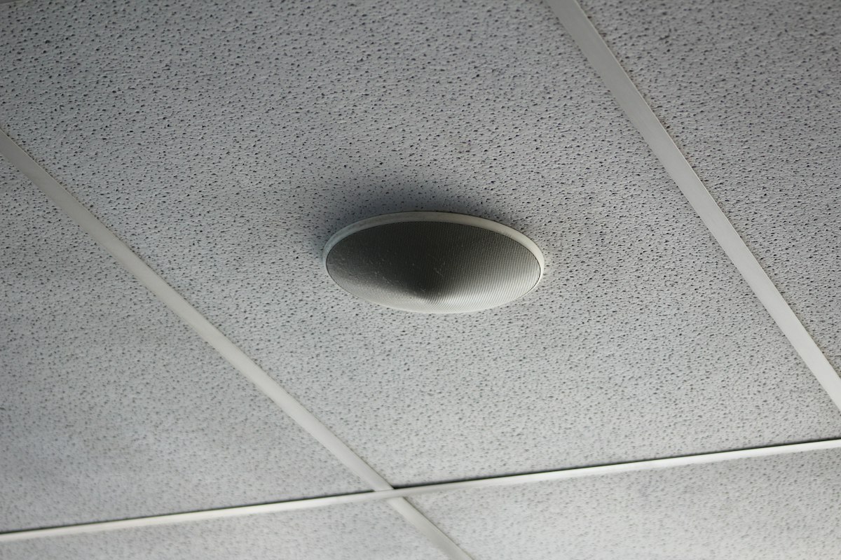 A round fixture set into a white ceiling