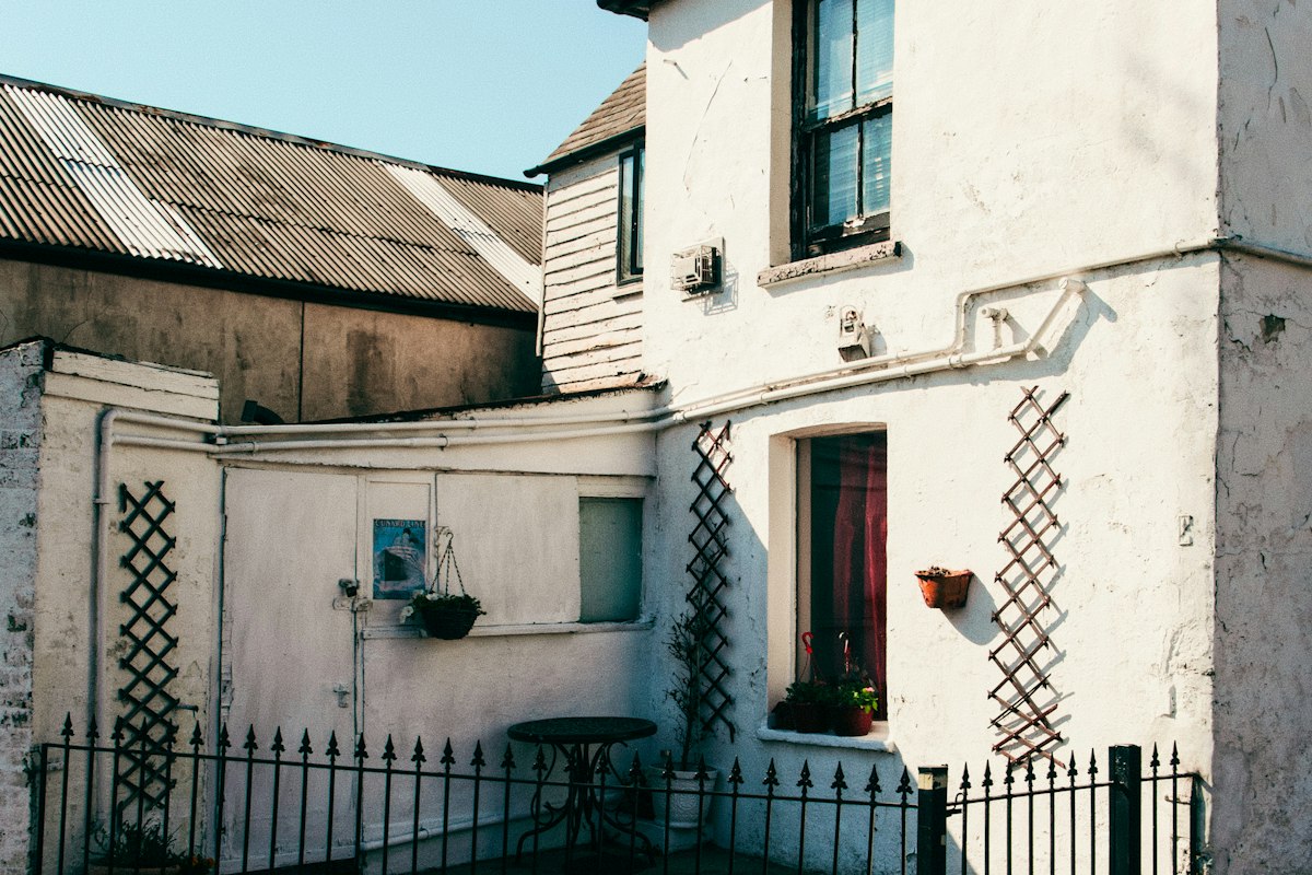 An older white house with weathered walls