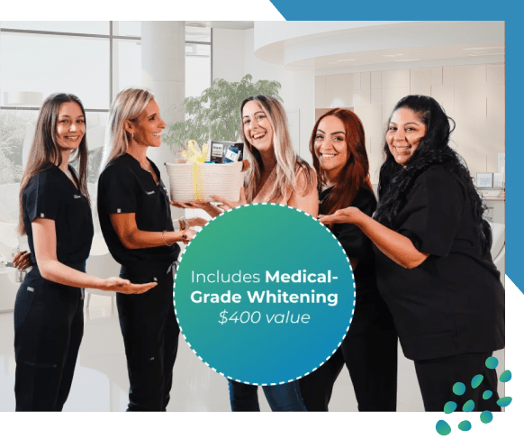 Hylan's team holding Teeth Whitening Gift