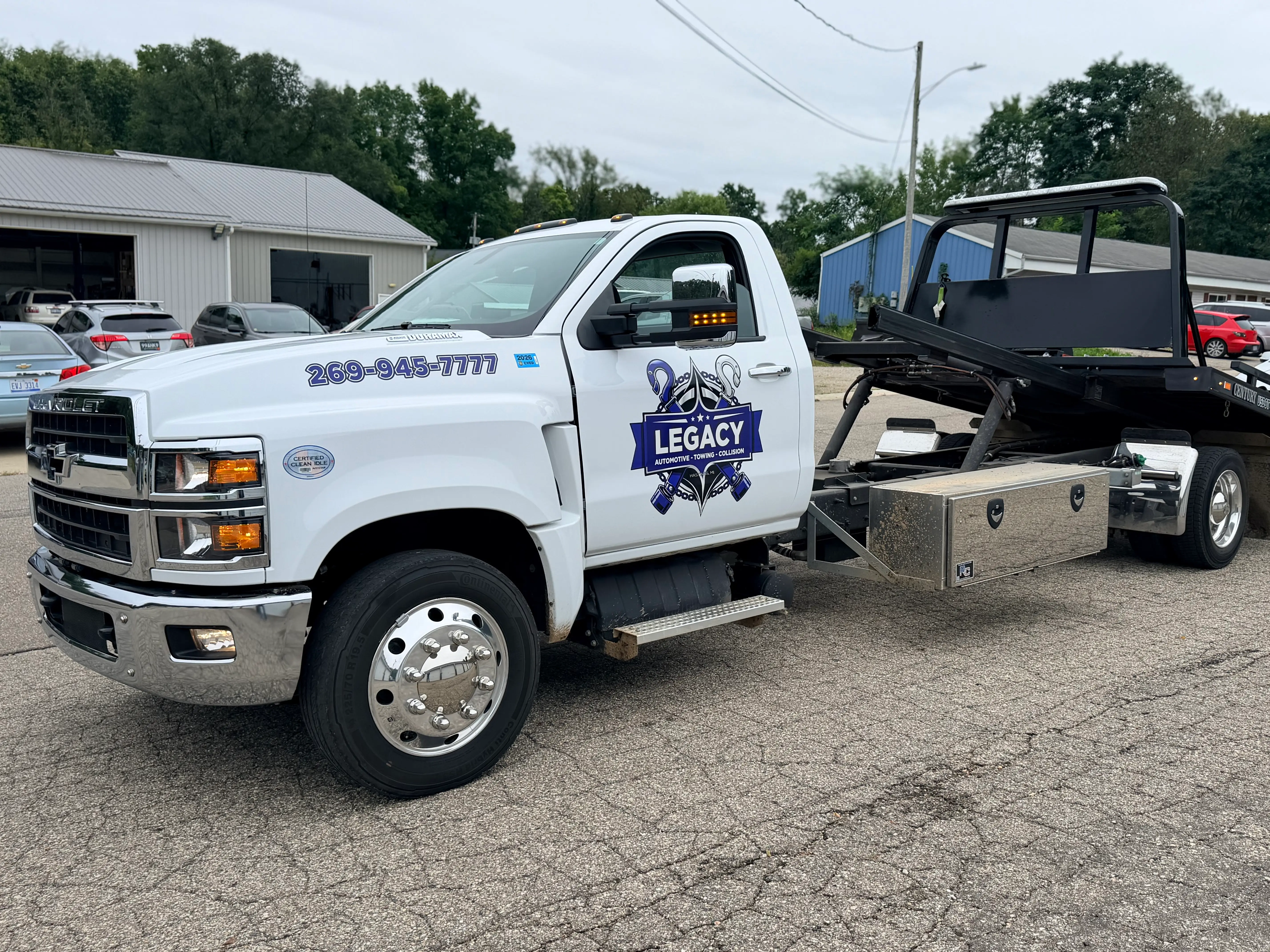 Legacy Automotive tow truck providing 24/7 emergency roadside recovery and vehicle transport.