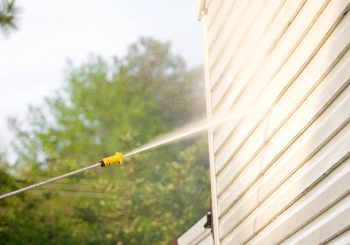 House soft washing service removing mould and dirt from exterior walls in Auckland