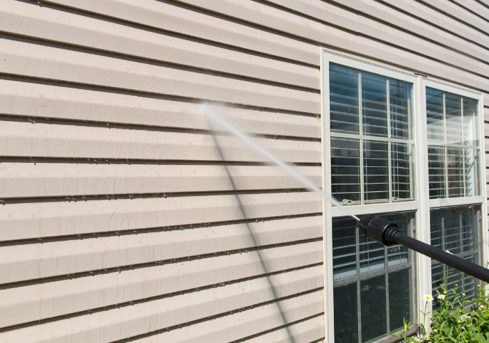 Exterior cleaning team providing pressure washing and softwashing services in Auckland