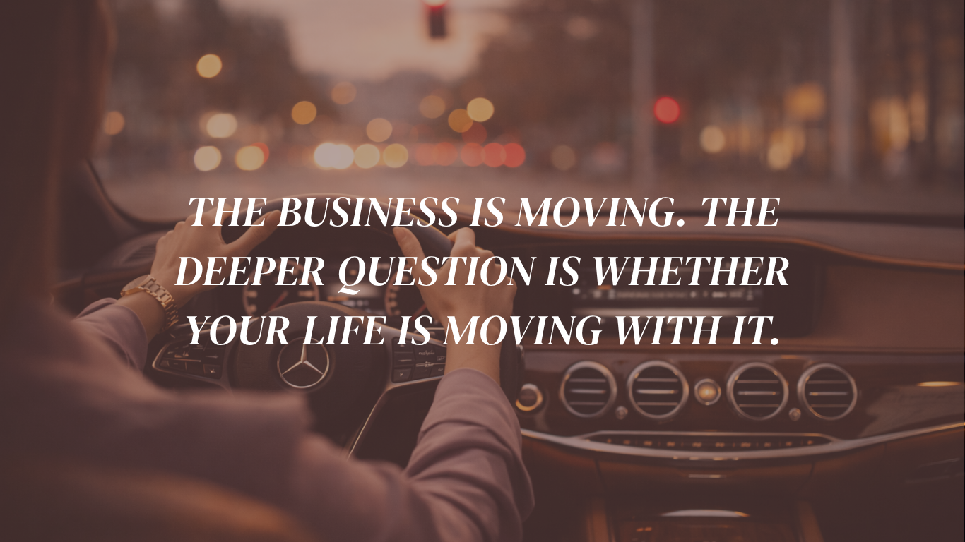 A consultant driving through a city at night with the words: The business is moving. The deeper question is whether your life is moving with it — on structural misalignment in consulting businesses.