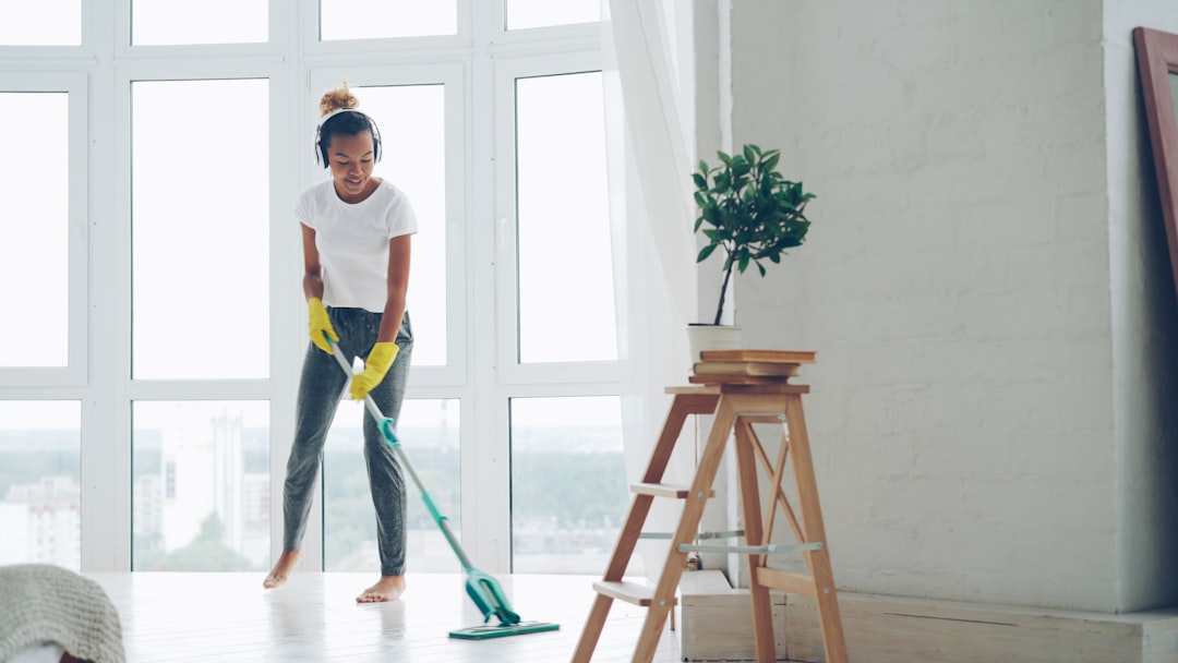 Professional cleaner in modern home