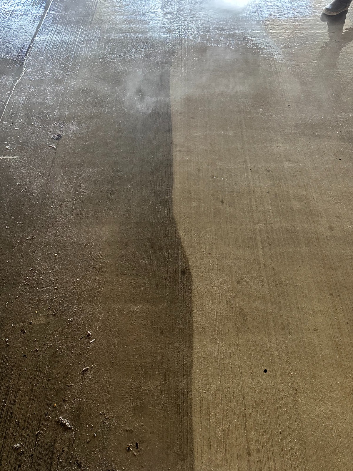 Professional power washing results on Dallas road surface