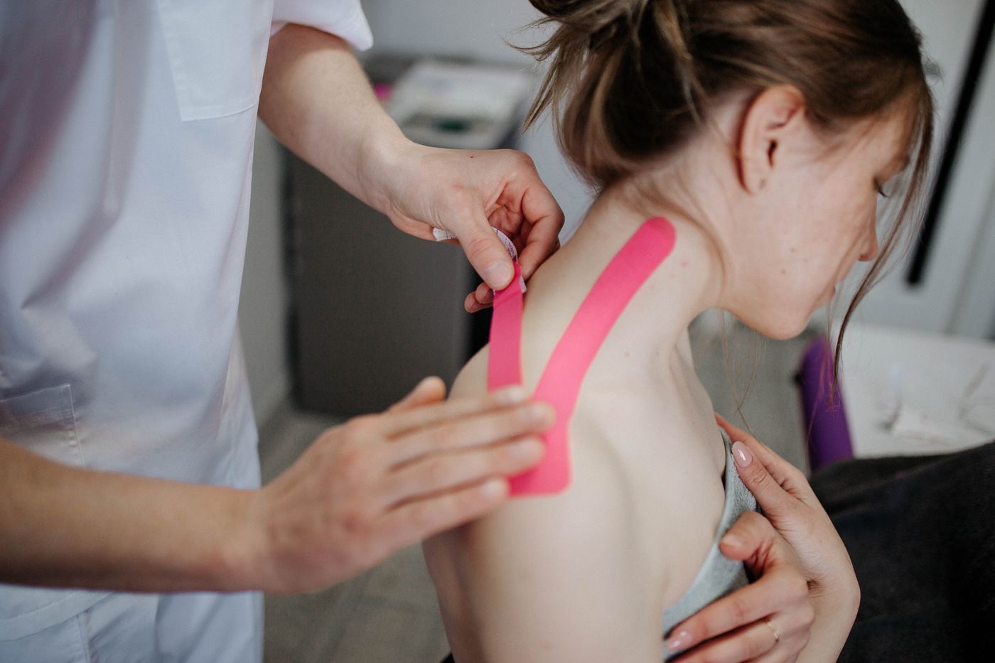 Clinician treating a patient's shoulder