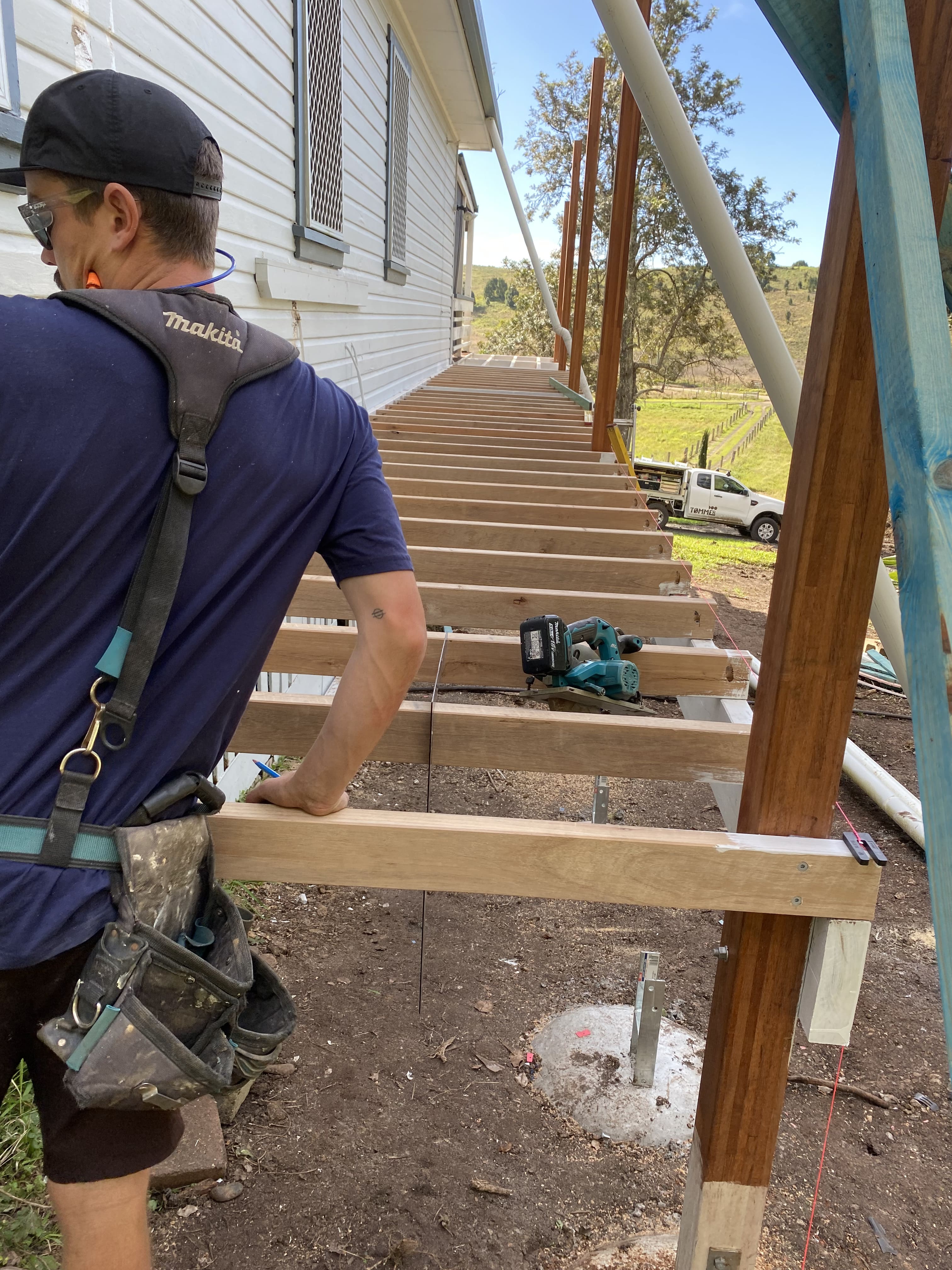 Carpenter building timber entry stairs on a home addition, Northern Rivers NSW