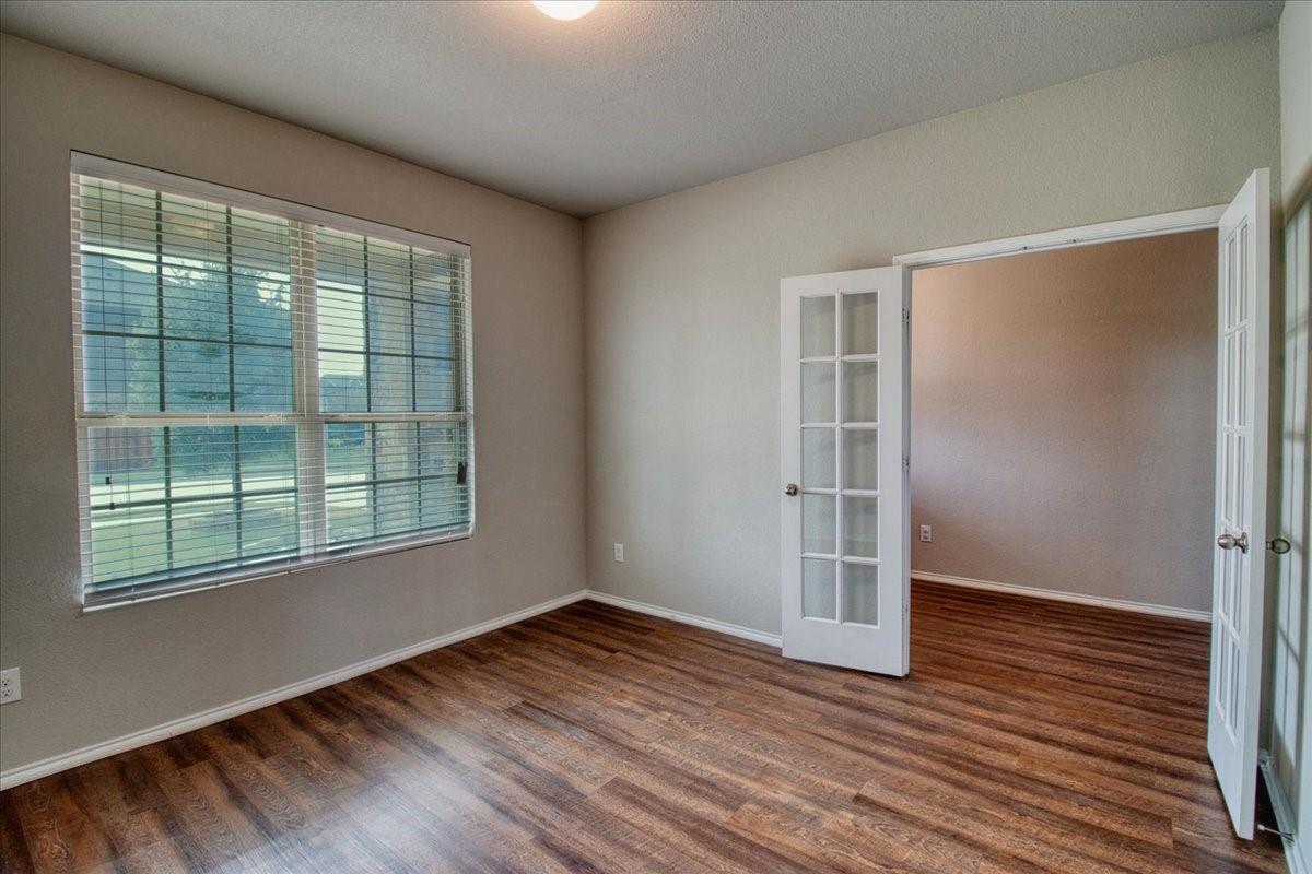 Front office with large window and French doors