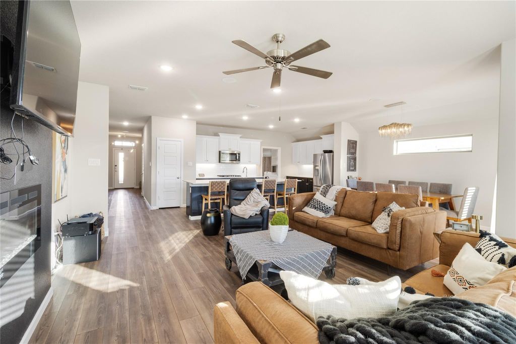 Open-concept living room flowing into kitchen