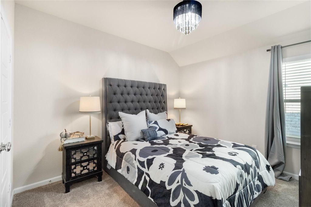 Bedroom with tufted headboard and nightstands