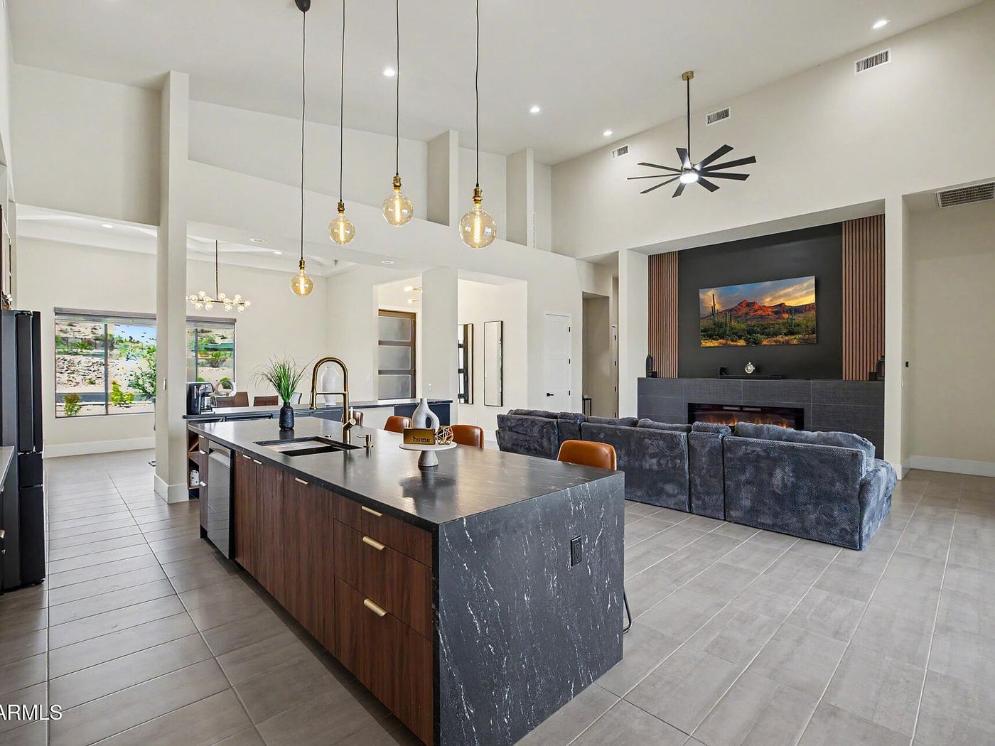 Great room with black waterfall island