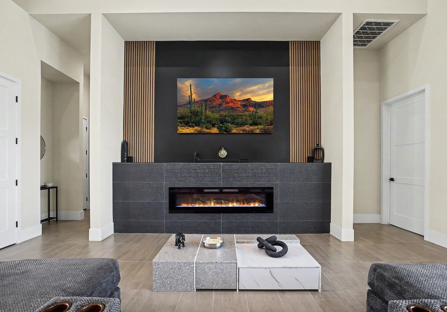 Living room with linear fireplace and wood-slat feature wall