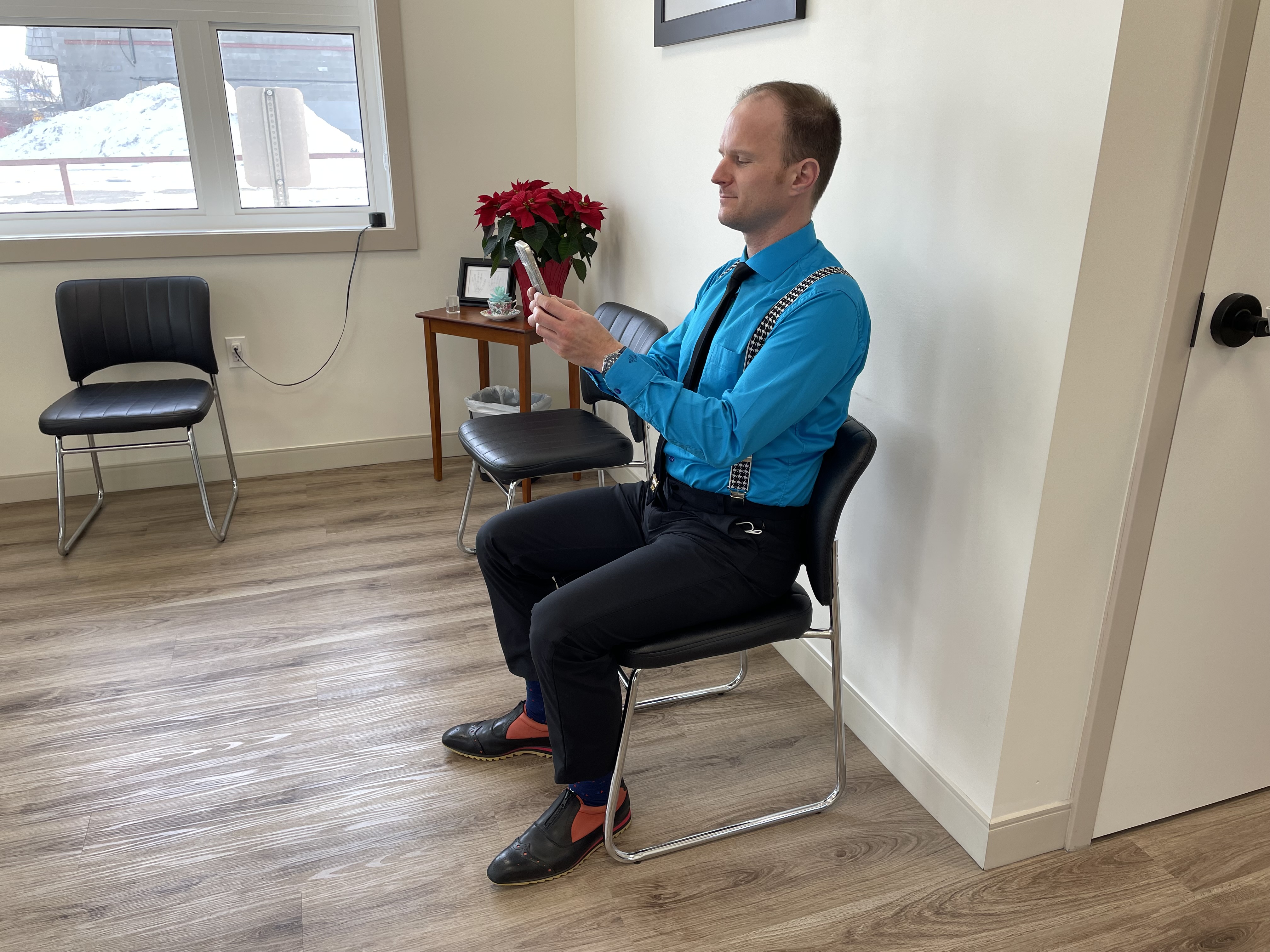 Chiropractor performing spinal adjustment on patient in Regina clinic
