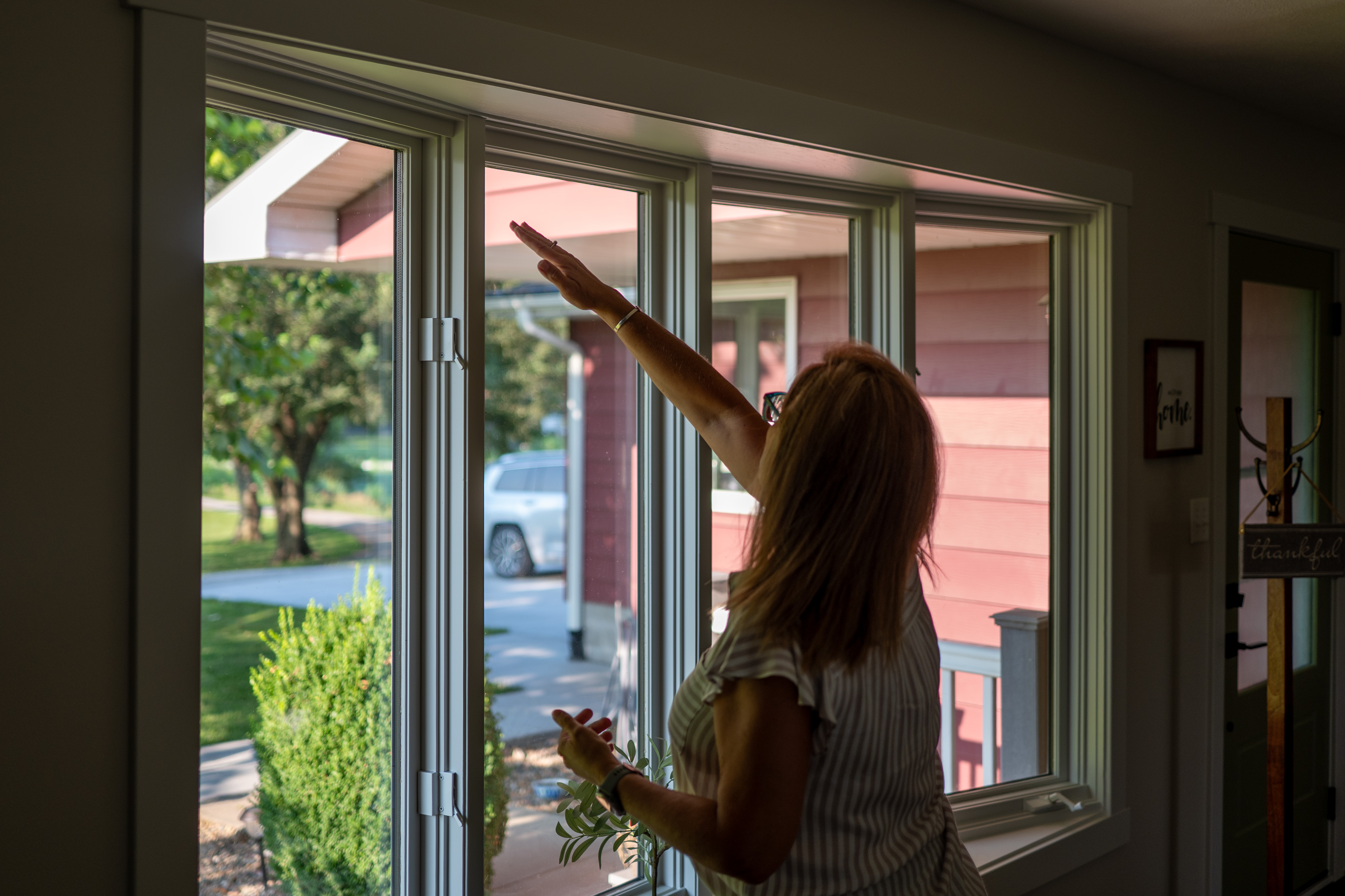 Jamie consulting a home owner for roller shades