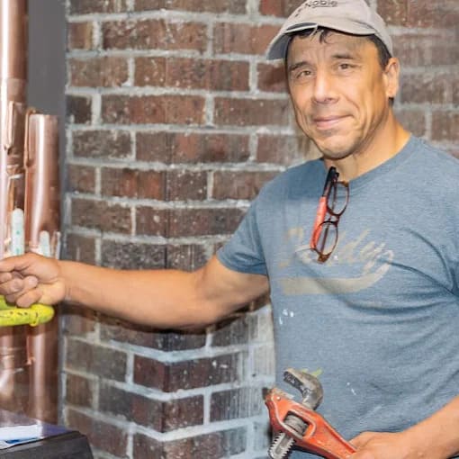Dea Mechanical plumber working on-site in Maple Ridge, BC