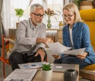 Senior couple reviewing their home valuation documents