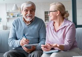 Senior couple planning their finances with an advisor