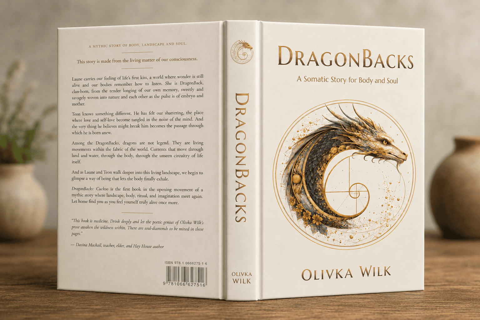DragonBacks hardback shown open, with front cover, spine and back cover blurb visible