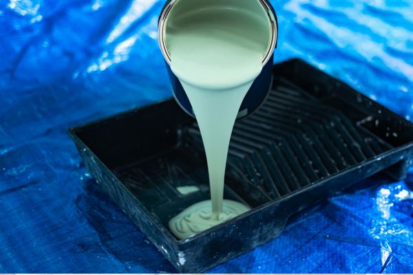 green water based paint poured in the plastic