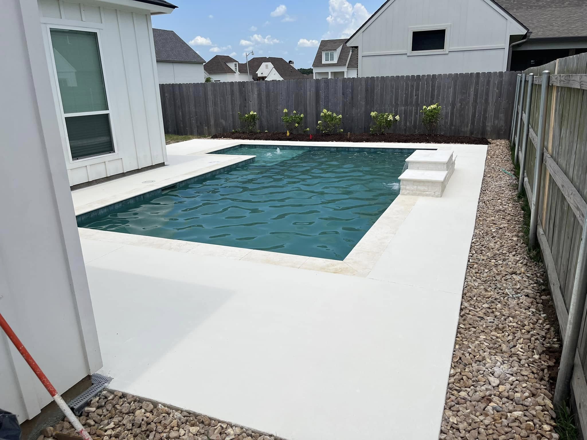 Beautiful custom pool with finished outdoor living area
