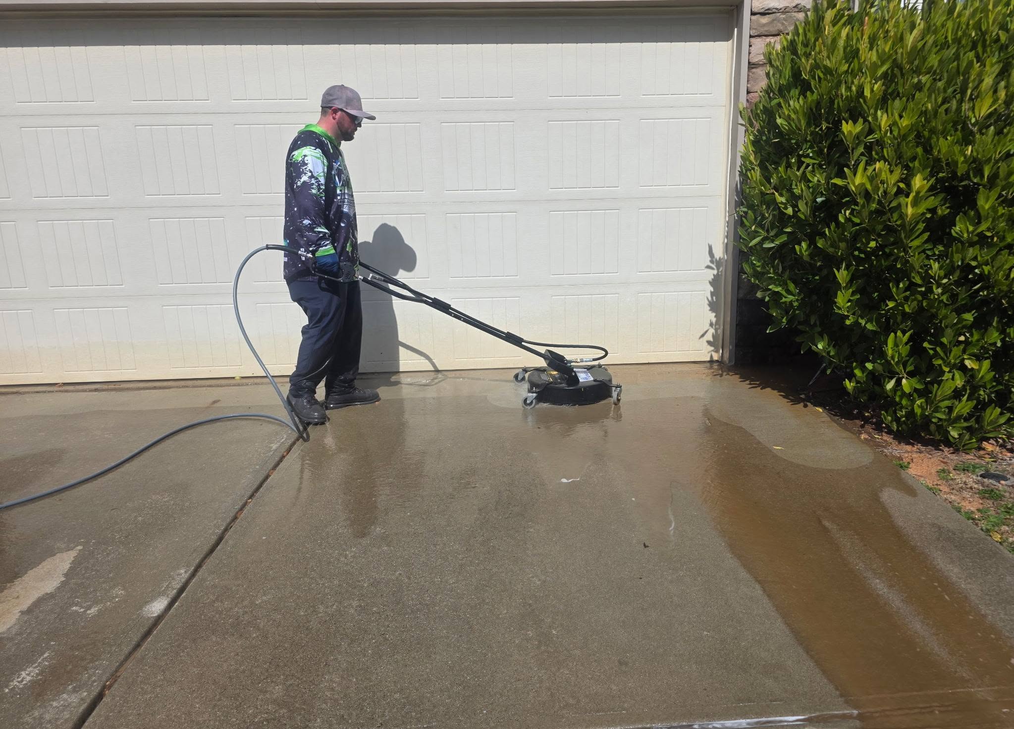 Driveway surface cleaning in progress