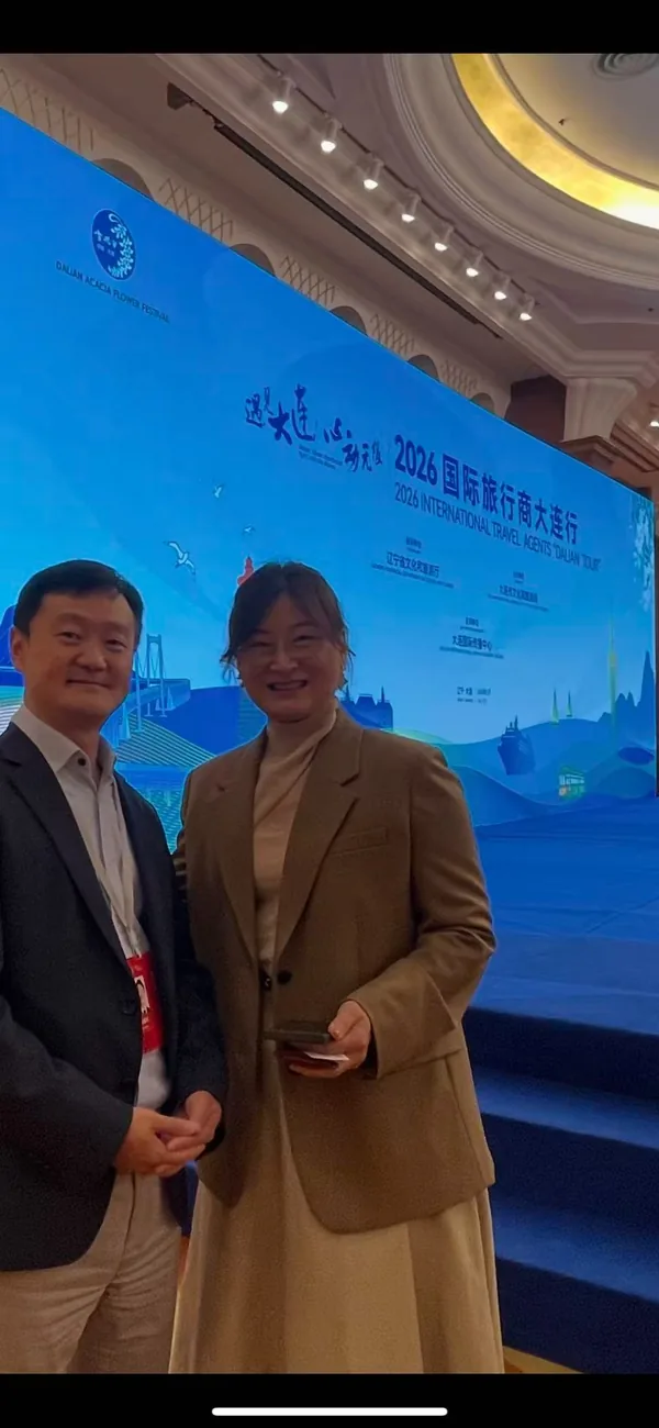 Prime Quality Group Director Alex with Kang Da-eun at the Dalian international tourism cooperation program