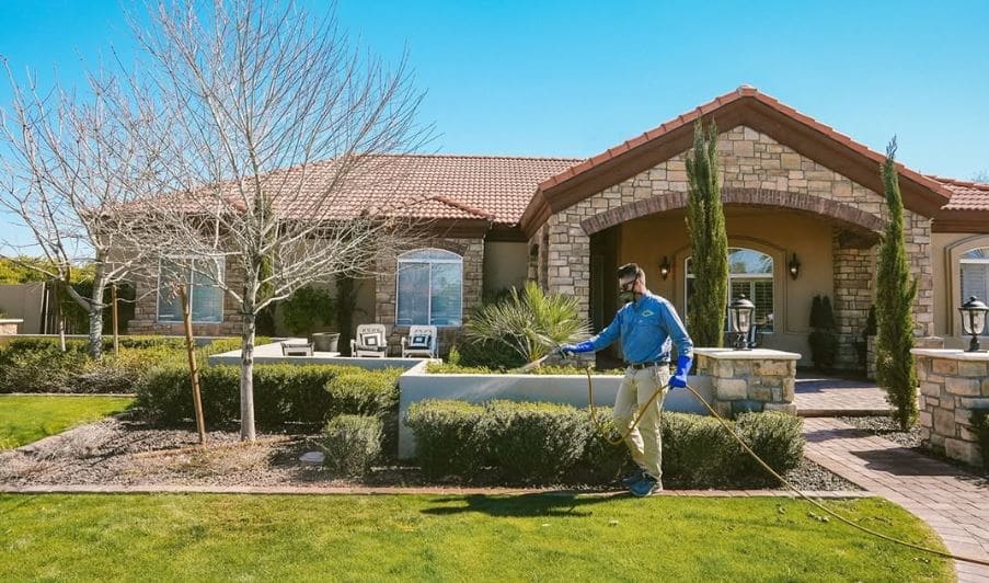 Kevlar Pest Control team and truck at an East Valley home.