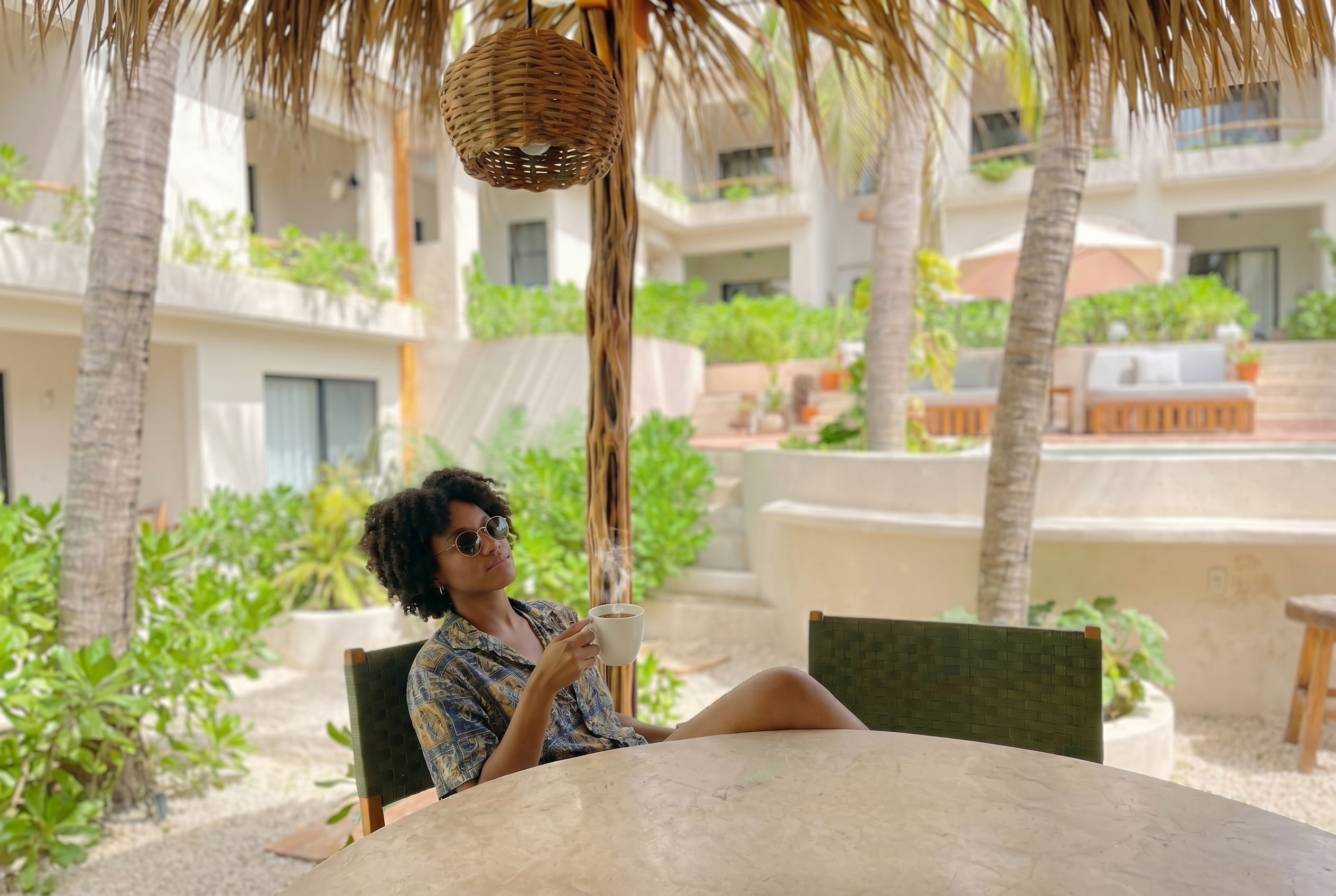 Guest enjoying morning coffee at Casa Leah Coffee Bar in Puerto Escondido