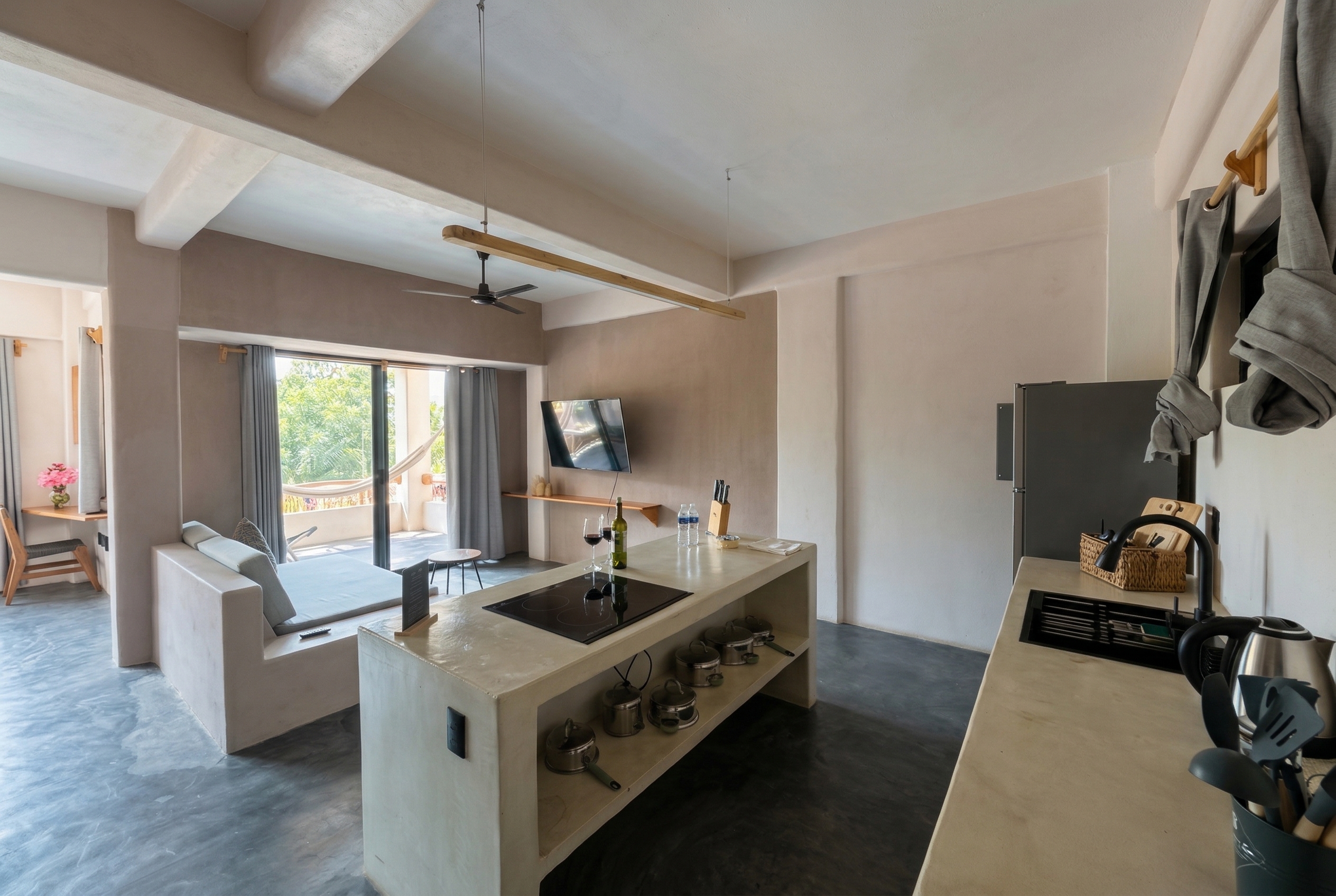 Open-plan kitchen and living space in the Balcony Suite