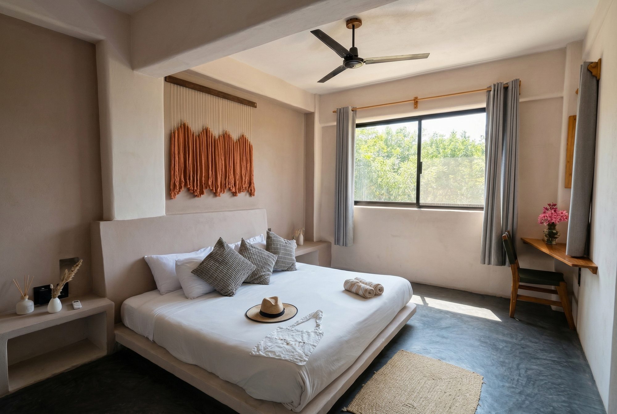 Boutique suite with king bed, macrame art and natural light at Casa Leah