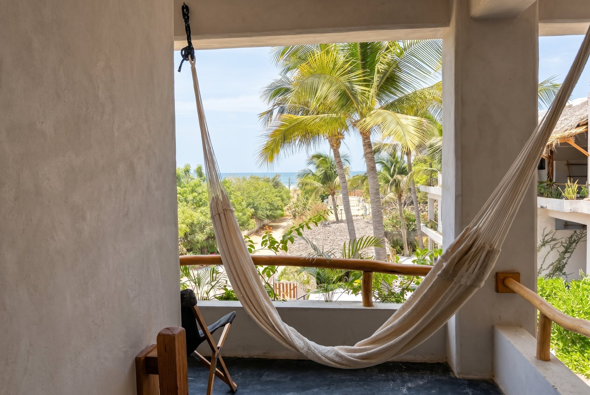 Private balcony with hammock and ocean view at Casa Leah Plunge Pool Suite