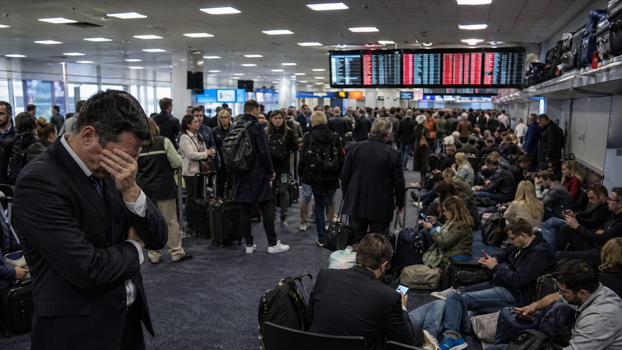 Airport chaos (Section 3) | "Busy commercial airport terminal showing travel delays"