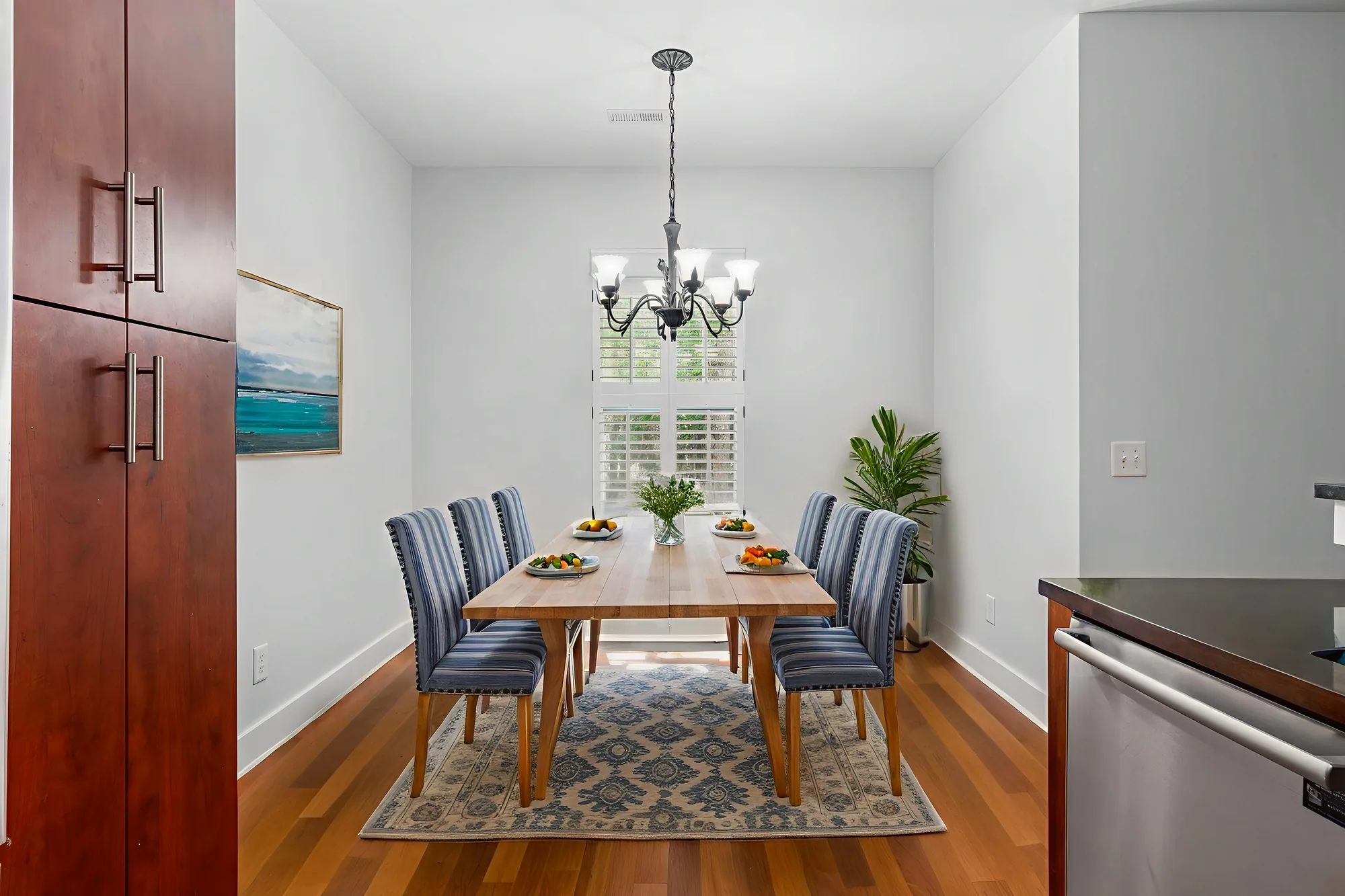 Virtual staging of an empty space staged with seating and decor