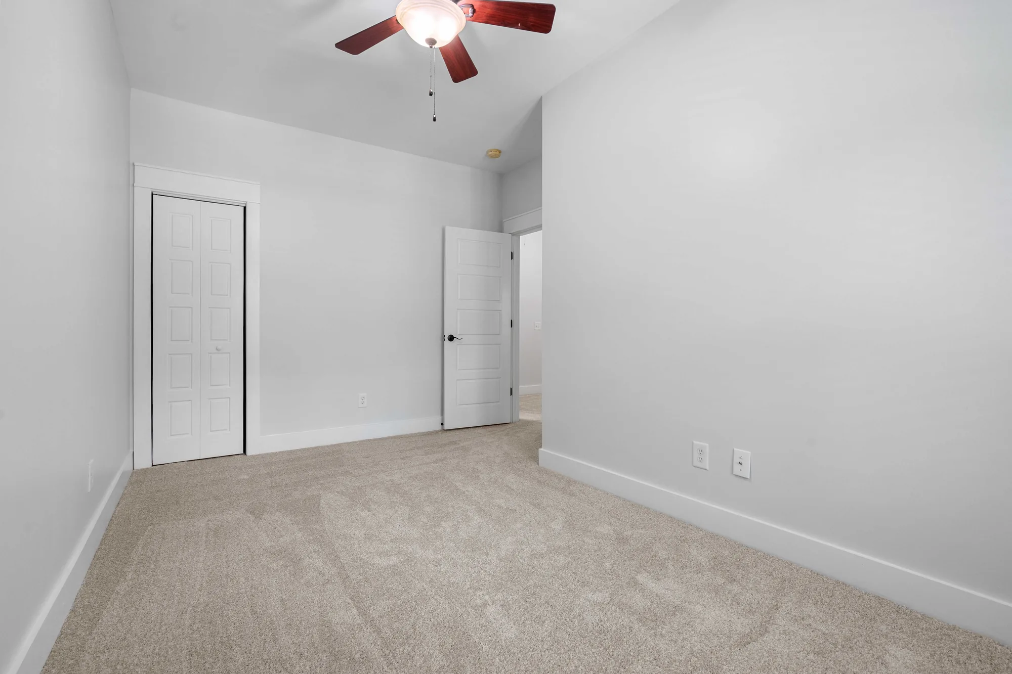 Virtual staging of an unfurnished room transformed into a styled interior