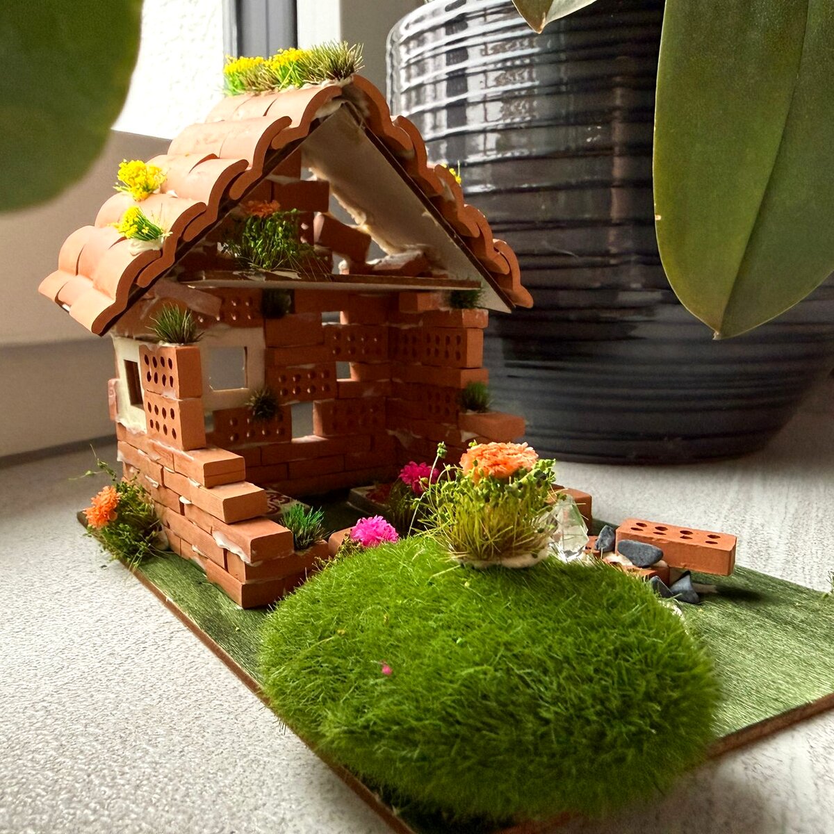 Miniature house with moss garden, created at the CreativitySpace