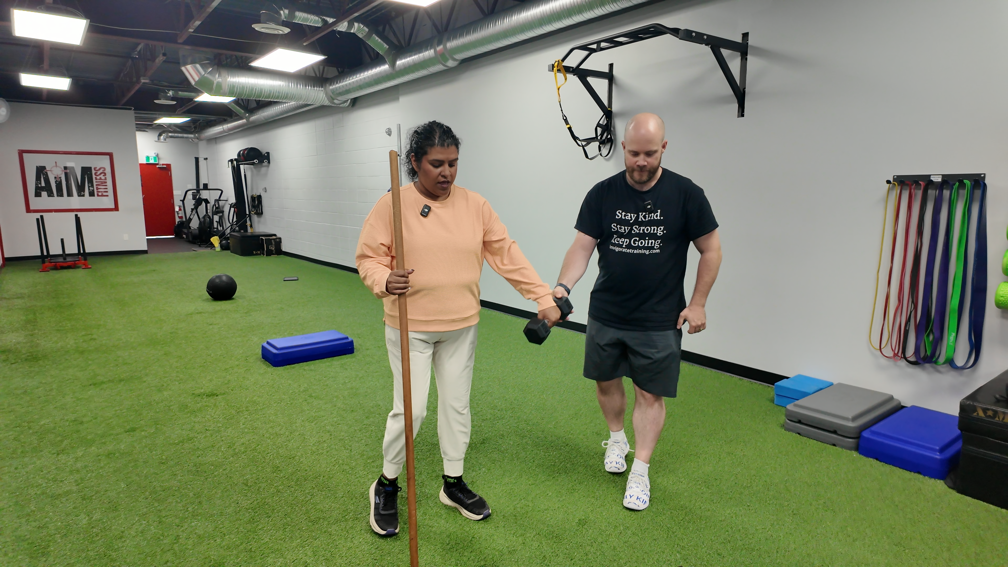 Coaching on the training floor at AIM Fitness