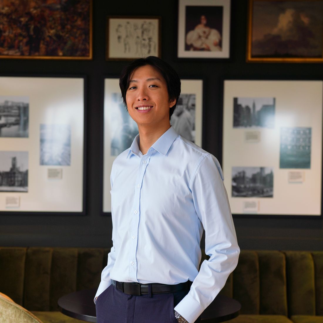 Harrisson Li, licensed Pennsylvania REALTOR, standing in a Philadelphia lounge