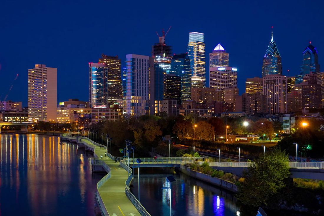 The Philadelphia skyline at night seen from the Schuylkill River Trail