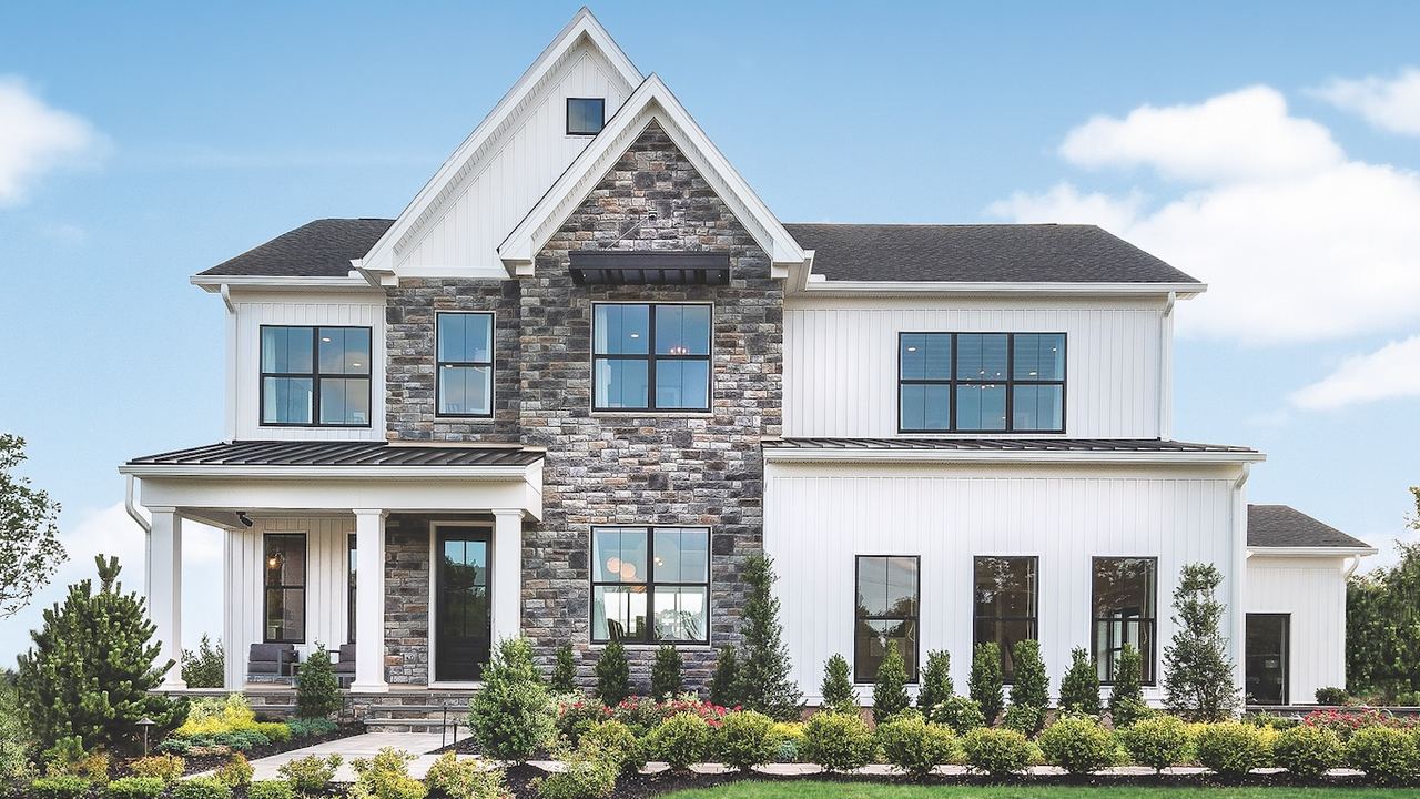 New construction home in the Philadelphia suburbs, stone and board-and-batten facade