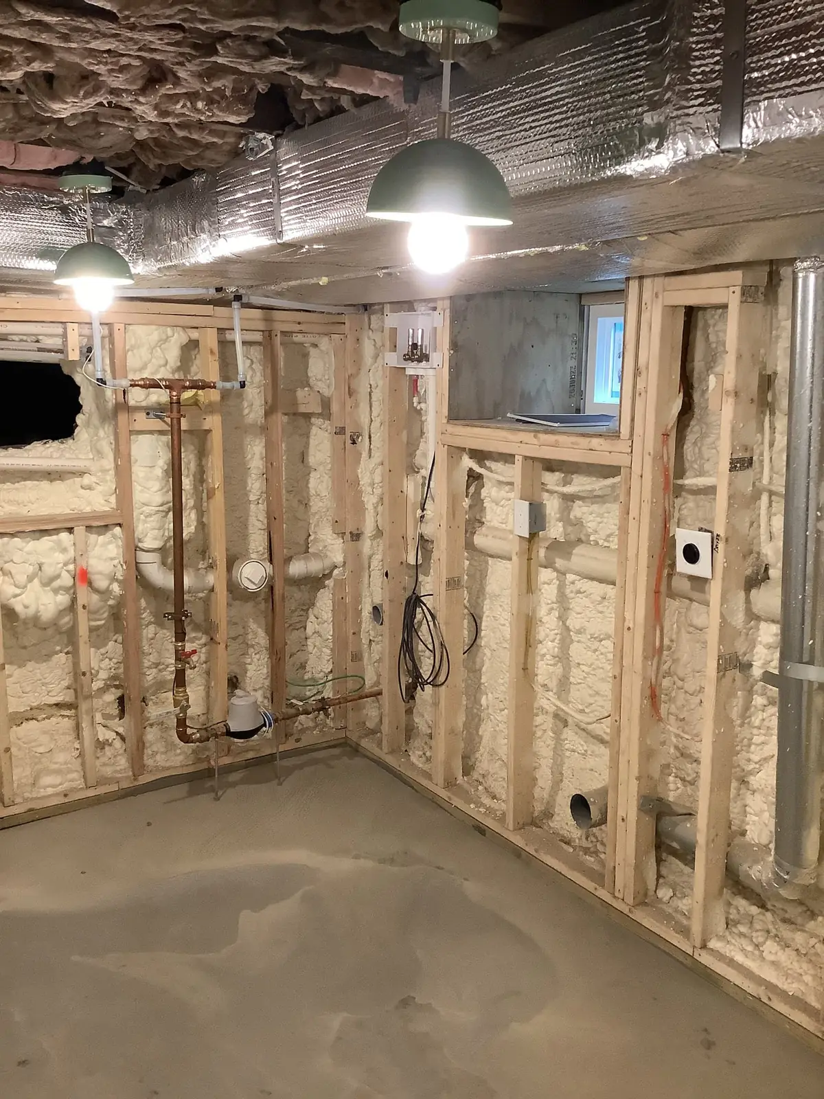 Exposed utility-area framing and wiring during remodeling