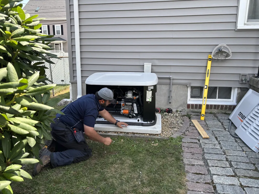 Sylvester Electric technician working on a Generac standby generator