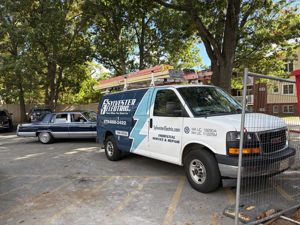 Sylvester Electric branded service van with a ladder rack