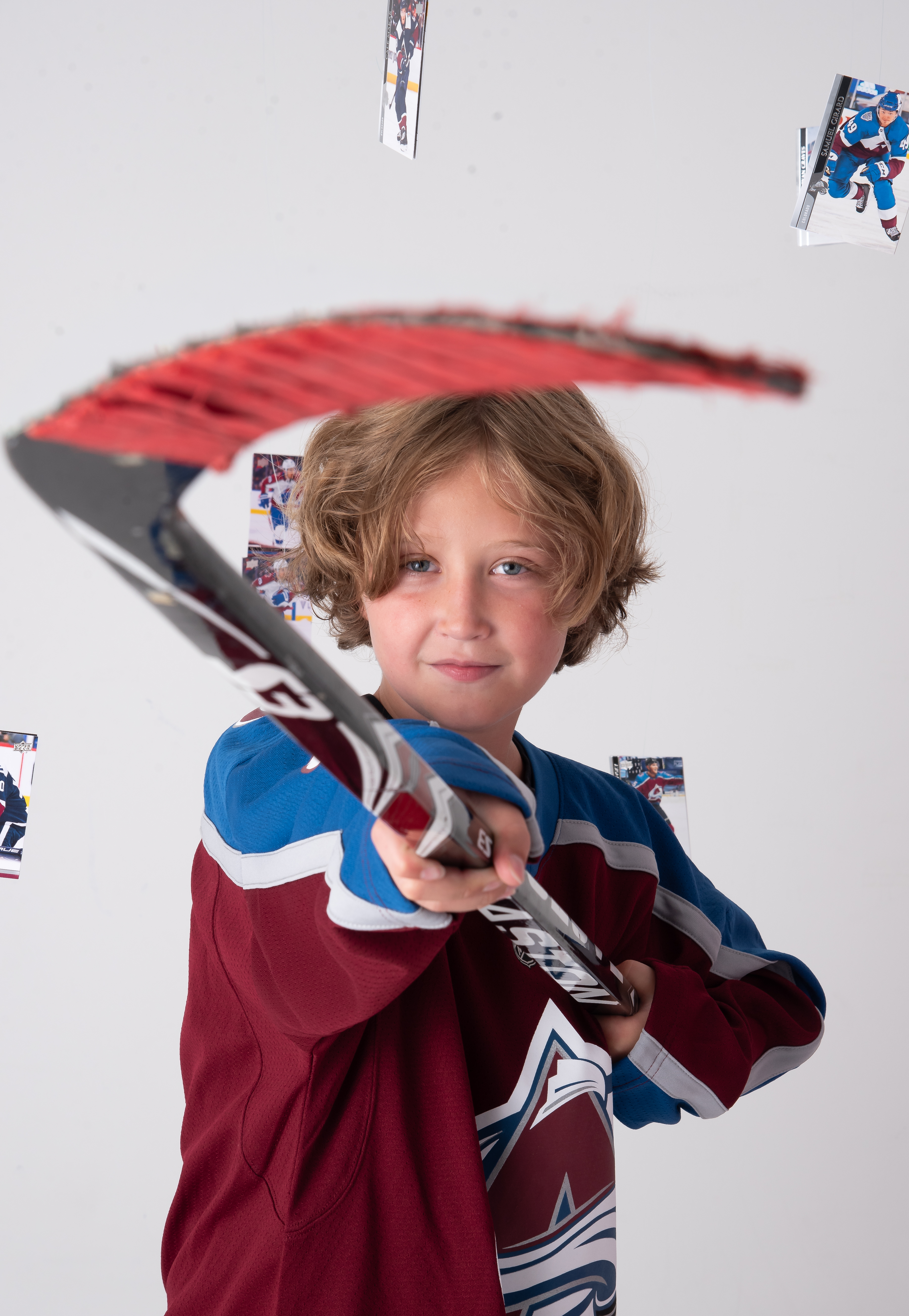 Ten year old holding his hockey stick 