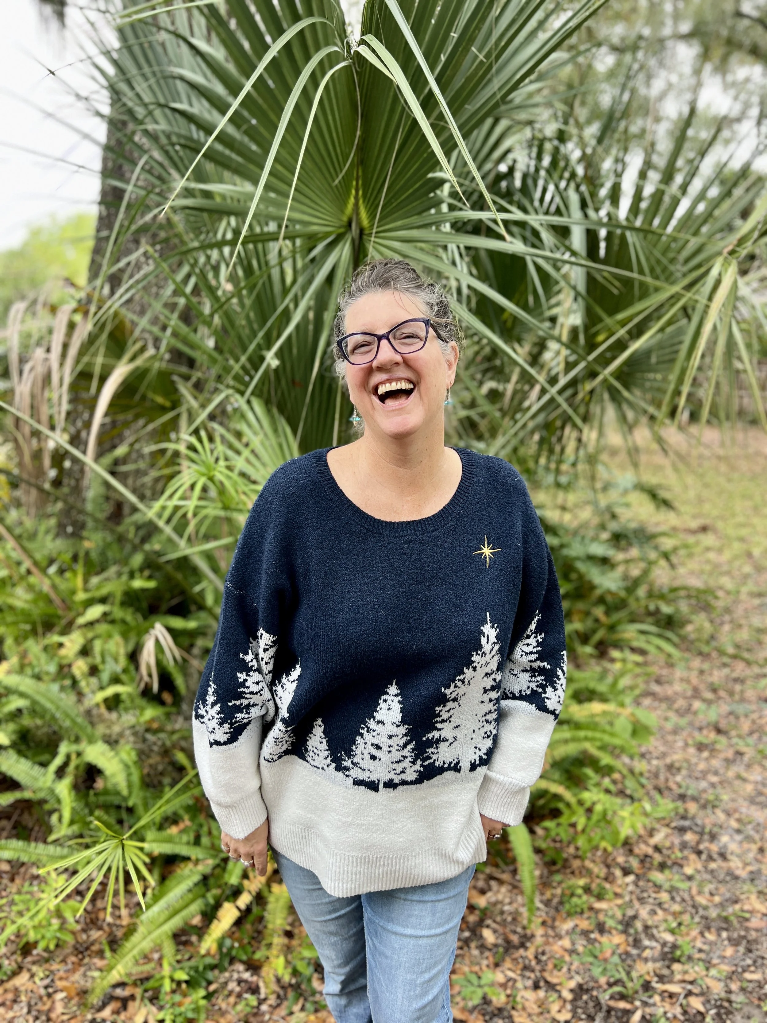 Tanja laughing among the palms