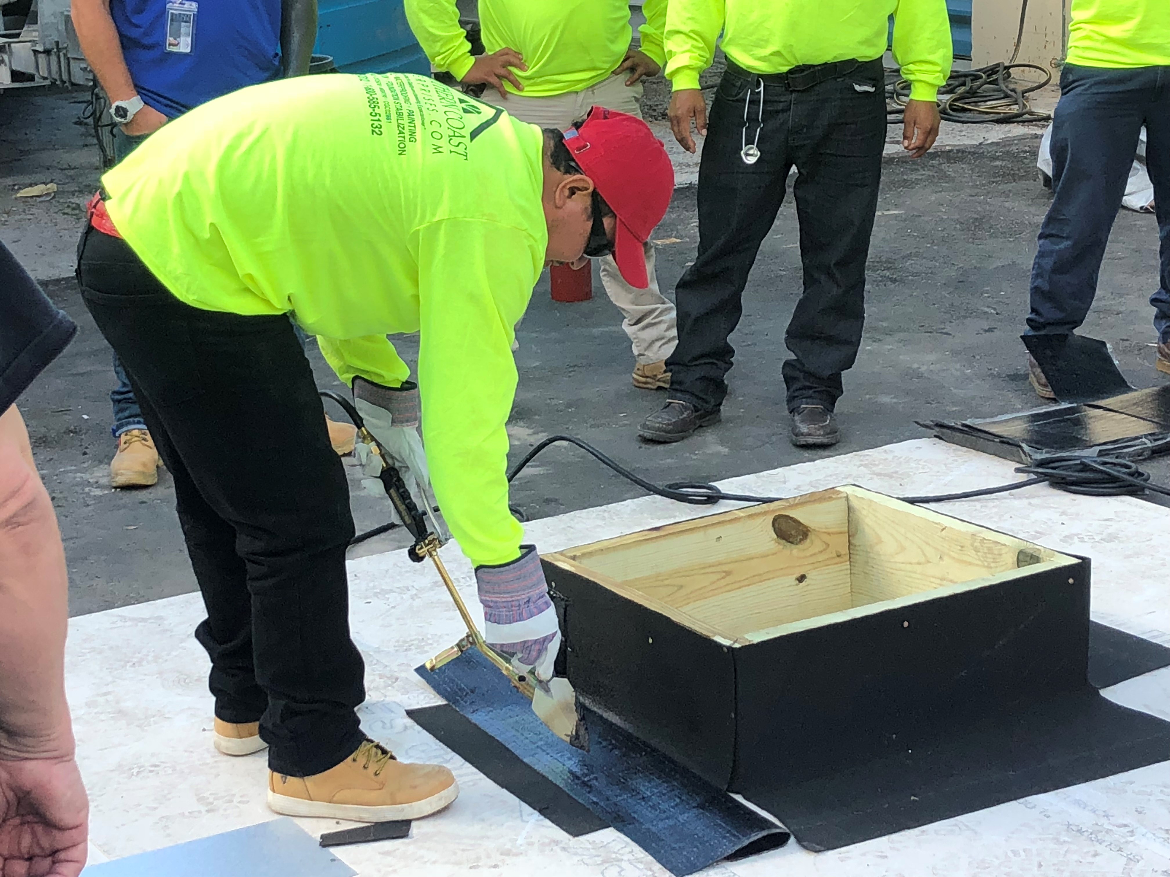 Southern Coast crew member working on a roofing training mock-up