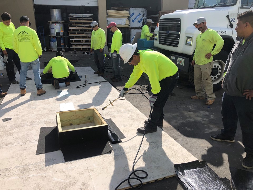 Southern Coast team members working on roofing mock-ups outdoors