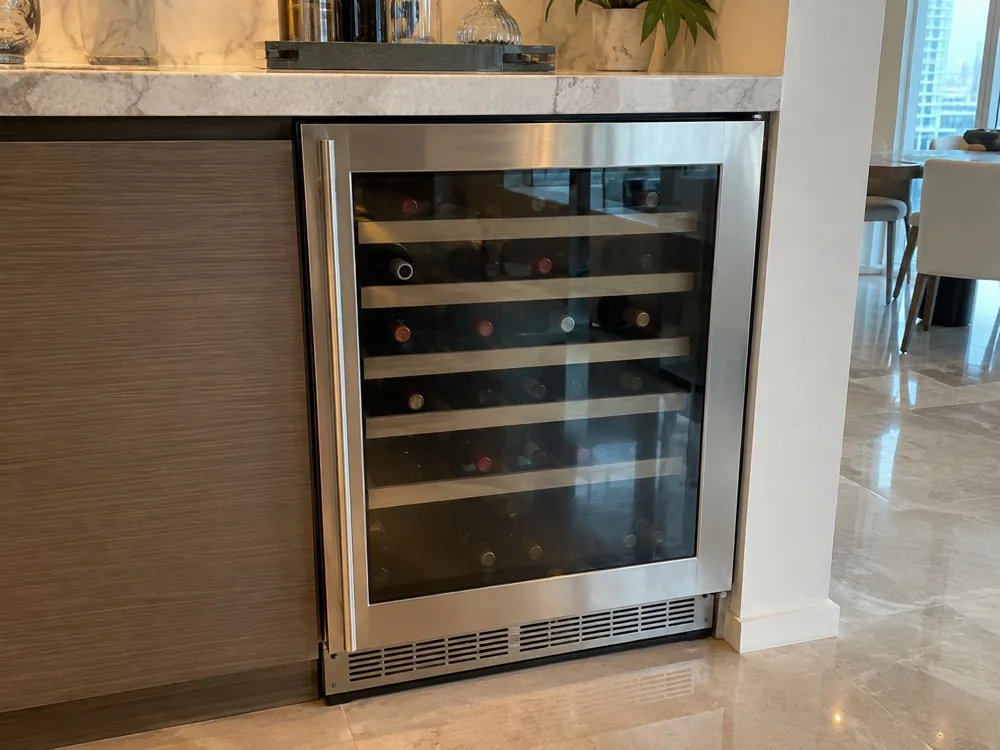 Undercounter wine cooler after temperature repair in a Miami home